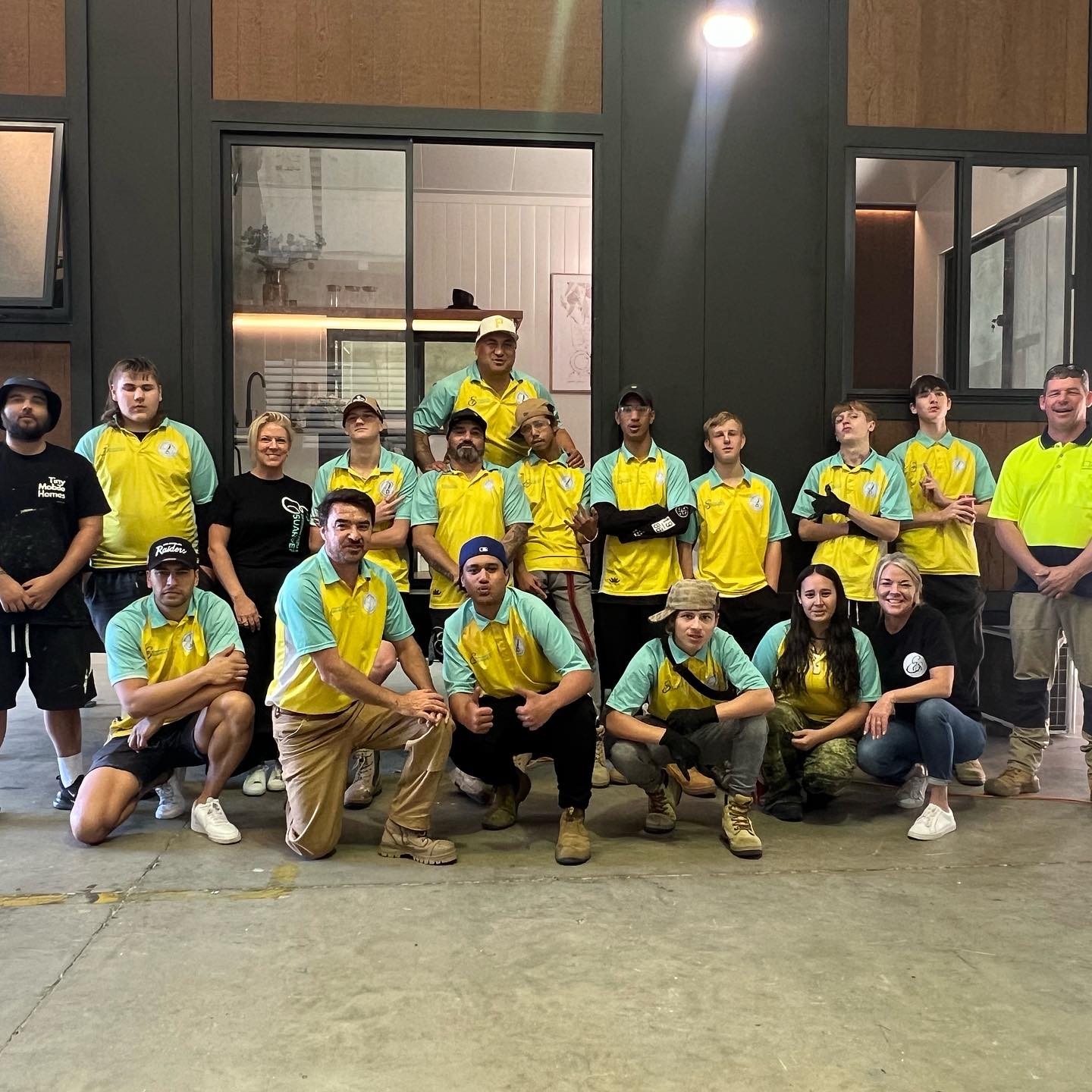 Joseph Te Puni-Fromont and Everything Suarve Inc. team engage in hands-on construction training with Gold Coast youth for skill development and empowerment