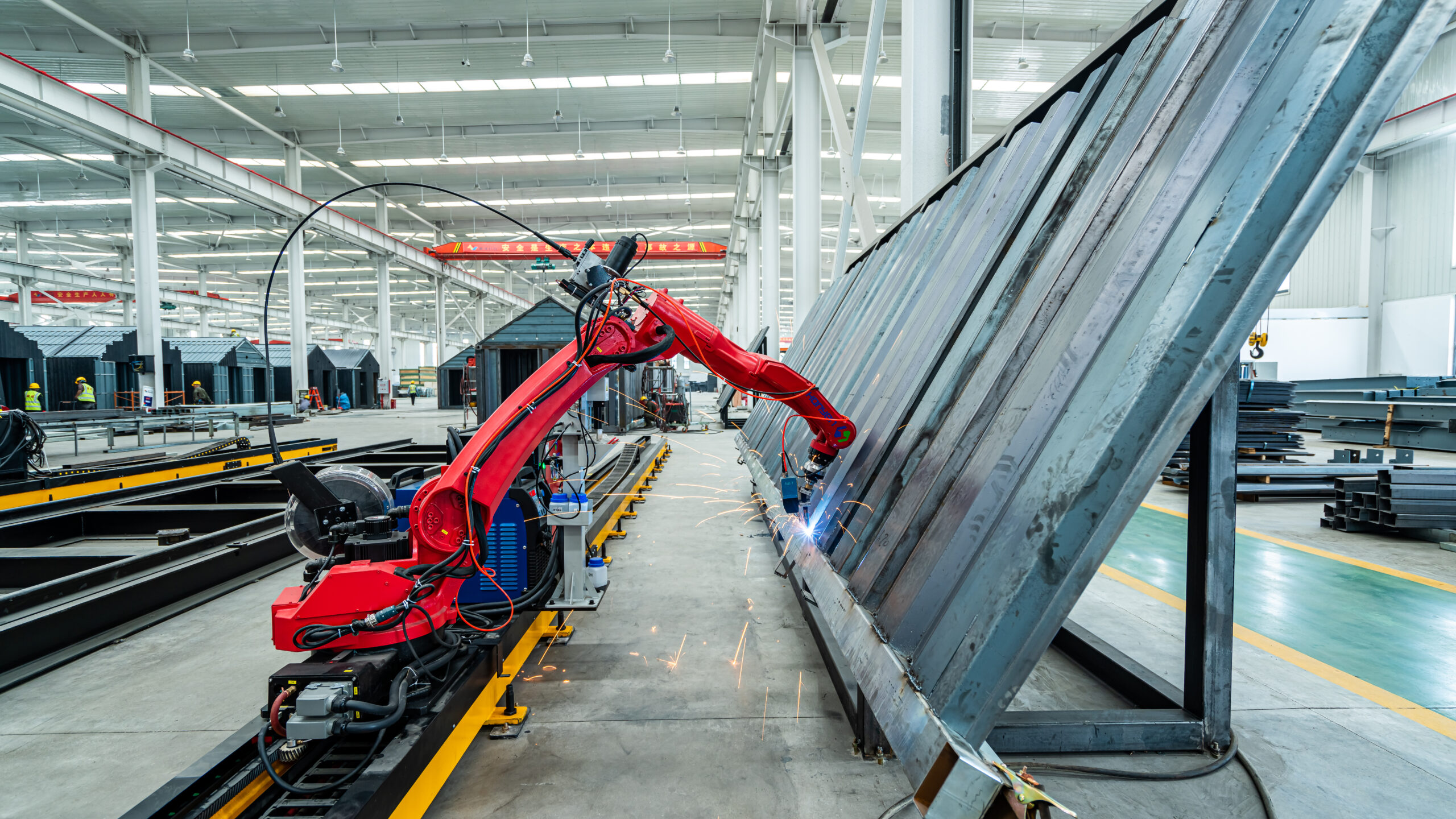 The Robotic Arm Is Welding In Steel Factory, China,asia.
